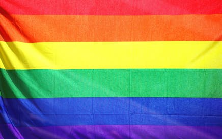 Close-up of a colorful rainbow flag symbolizing LGBT pride and diversity.
