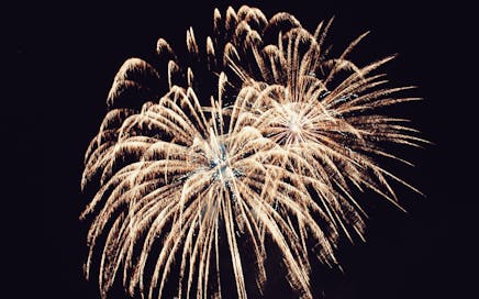 Stunning fireworks burst against the dark night sky, perfect for festive occasions.